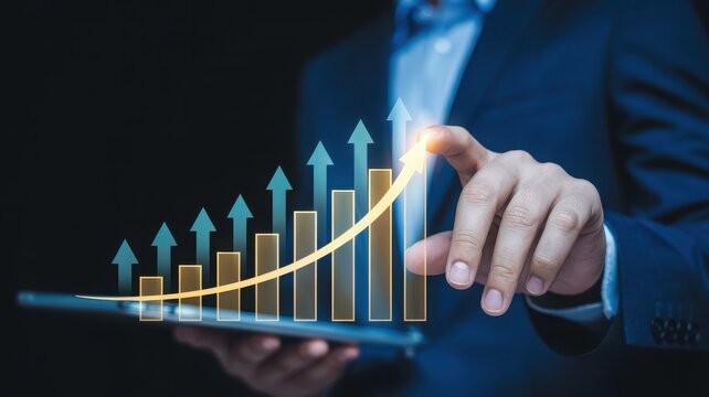 Businessman s hand pointing at a rising financial bar graph with upward arrows on a digital tablet screen - Powered by Adobe