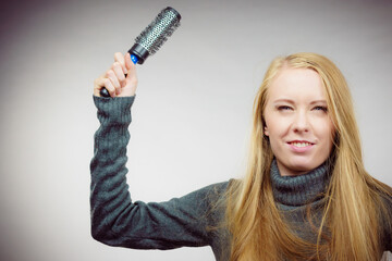 Girl styling her long hair