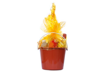 Plastic bucket filled with food, drinks, and essentials wrapped in golden transparent plastic,...