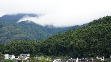 Obraz premium The beautiful mountains view with the covered fog on them