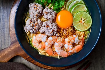 Homemade instant noodles soup with shrimps minced pork and eggs	