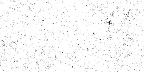 Abstract grunge background with black ink splats and wet textured paint splashes on a dirty glass surface