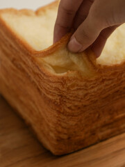 Tissue bread or layer toast on wooden cutting board