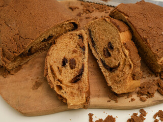 Loaf of bread on wooden cutting board