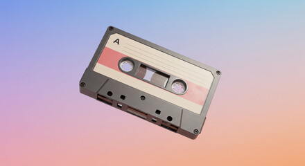 A vintage cassette tape floats against a colorful, gradient background, showcasing retro audio technology.