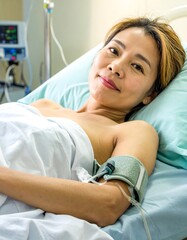 Woman in Hospital Bed Receiving Medical Care