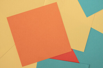 Blank orange memo square sticker note on colorful notes background