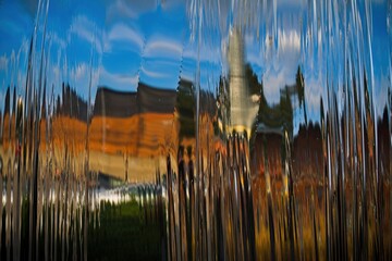 Reflection on black polyethylene film with colorful distortions and abstract vertical patterns,...