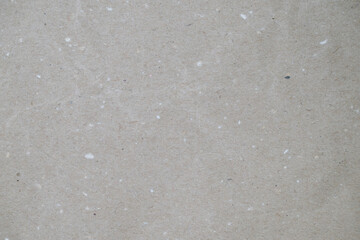 Recycled brown paper texture with natural fibers and speckles
