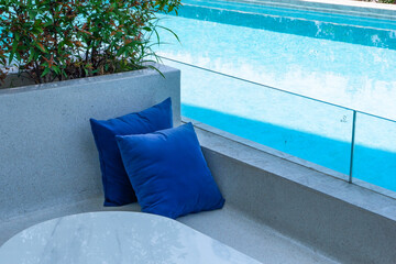 Empty swimming pool with table and chairs in summer,sofa resort neary sea and beach,restaurant and...