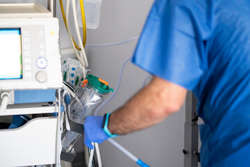 Doctor using medical equipment in hospital operating room