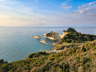 Cape Drastis headland and sea stacks in Corfu, Greece, with turquoise waters and a clear blue sky
