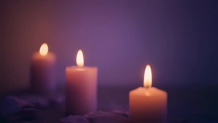 Softly flickering candles against a muted purple background. A calm, romantic, and spiritual cinemagraph loop for meditation, relaxation, or memorial concepts. Generative AI - Powered by Adobe