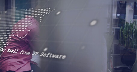 Leaning man in magenta shirt examining monitor showing code overlay in office, LED grid, copy space