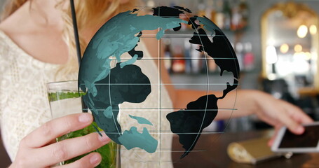 Featuring translucent globe overlay across bar counter, with woman holding mint drink in tall glass