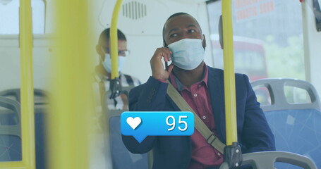Sitting businessman wearing blazer and mask on bus talking on smartphone, messenger bag, handrails