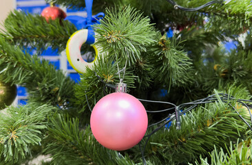 Retro Christmas tree toy decorated with garlands, background