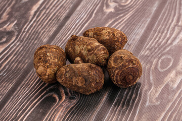 Brown topinambur roots for cooking