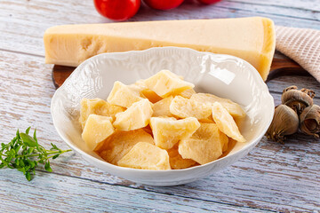 Parmesan cheese pieces in the bowl