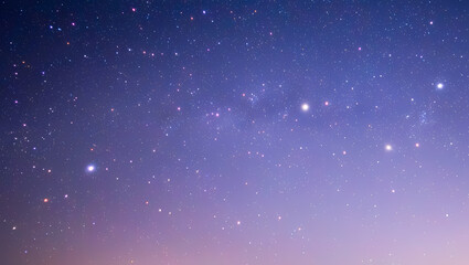 Vast starry night sky with a gradient of purple and pink hues, showcasing distant galaxies