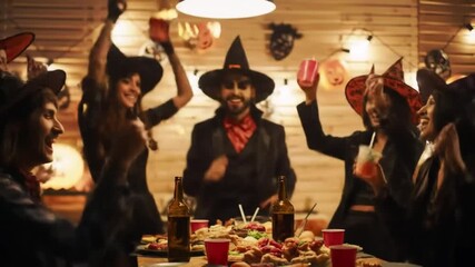 A lively Halloween party scene featuring adults in costumes celebrating with food, drinks, and festive decorations, creating a vibrant atmosphere of joy and merriment