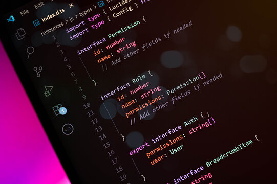 Close-up shot of TypeScript code editor interface on a dark theme screen, showing object-oriented programming structure. Suitable for coding, software development, and web applications.