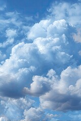 A vast expanse of puffy cumulus clouds against a vibrant blue sky
