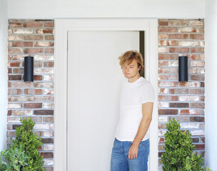 man opening doors of house (hotel, store)