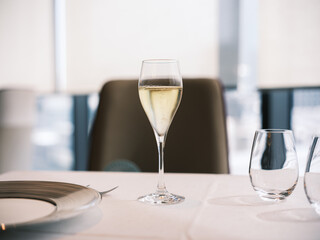 Elegant Glass of Champagne on White Tablecloth in Fine Dining Restaurant