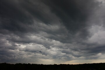 Clouds over the forest in summer