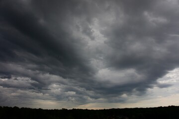 Clouds over the forest in summer