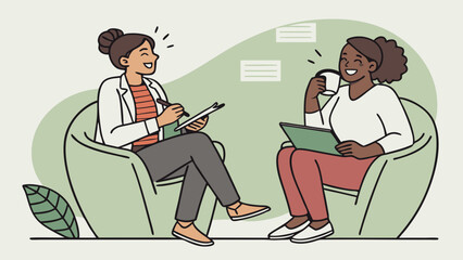 Two women having a friendly conversation while sitting in armchairs one taking notes and the other drinking from a mug.