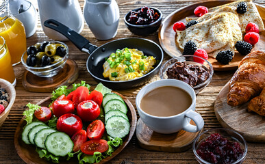 Breakfast served with coffee, eggs, cereals nd croissants