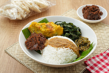 Nasi Padang or Nasi Kapau, rice with various side dishes rendang, egg, and sambal. Indonesian Food