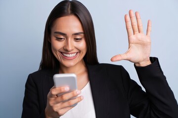 Smiling Woman Waving While Viewing Smartphone Screen – Business Connection