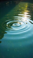 Serene ripples spreading across a calm pond's surface, sunlight reflecting beautifully on the water Perfect for nature, relaxation, and tranquility themes , day, water