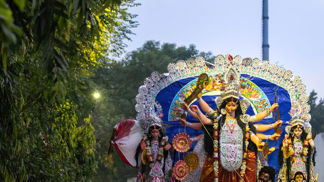 Durga puja with idol of goddess Durga during festival celebration. Idol being transported for visarjan ceremony during vijaya dashami or dussehra