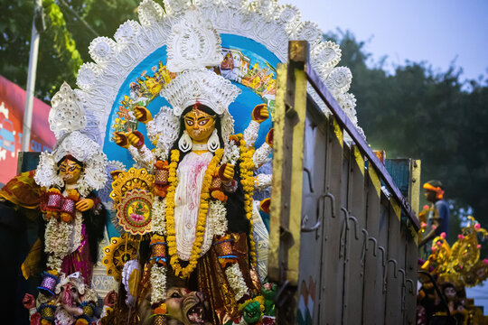 Durga Puja with idol of goddess Durga being transported for festival during vijaya dashami for visarjan or immersion.
