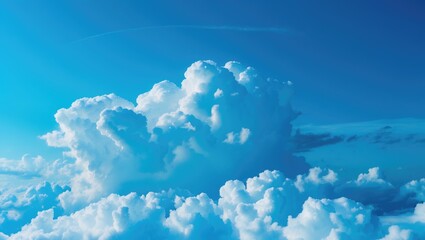 Clouds against a blue sky with a contrail. Sky and weather, natural phenomena. Atmospheric and meteorological conditions. The concept of weather and cloud formations.