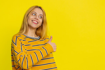 Like. Caucasian woman raises thumbs up agrees with something or gives positive reply recommends...