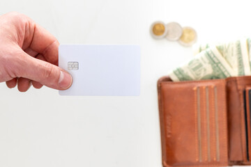 Obraz premium blank credit card with wallet, cash and coins on background