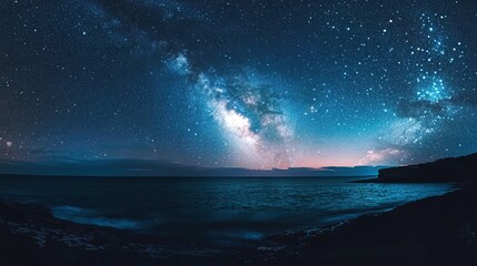 Night ocean with countless stars above soft glow reflex