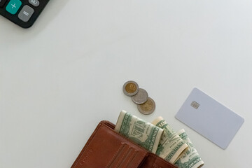 blank credit card with wallet, cash and coins on background