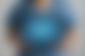 Blurred Human Torso in Blue Shirt with Soft Light and Grain Texture image photo