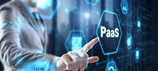 Hand pressing button on interface PaaS, Platform as a Service. Internet and networking concept