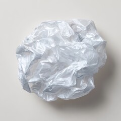 Fototapeta premium Close up of a crumpled piece of translucent white and pale pink paper with a textured surface and soft shadows