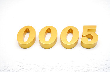 The numbers are made of gold-painted wood, placed on a white background.