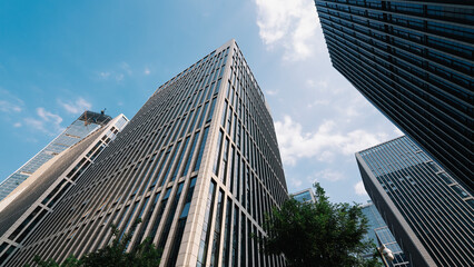 Modern skyscrapers in an urban business district under a clear blue sky