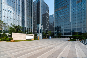 Fototapeta premium Modern office buildings with glass facades in an open area