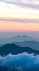 Obraz premium Misty mountain range at sunrise